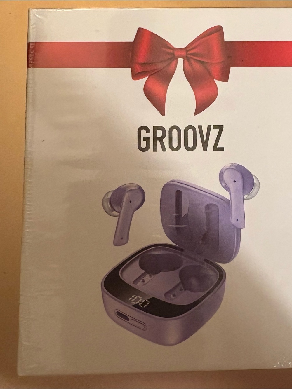 Groovz earbuds with charging case.  Purple/lilac. Sealed